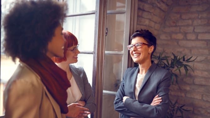 women chatting in the workplace