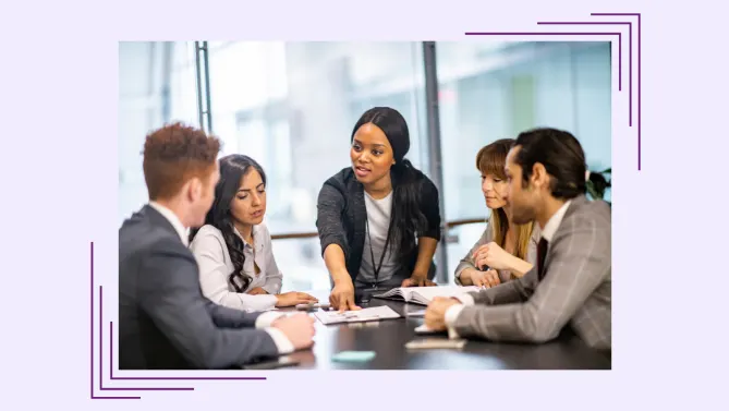Five people in a meeting.