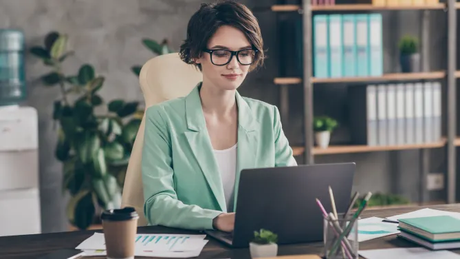 woman typing at desk