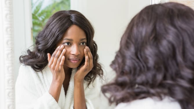 woman looking in a mirror