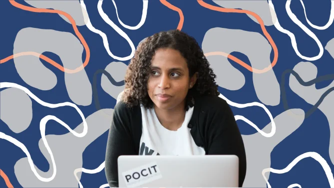 woman on laptop looking into the distance