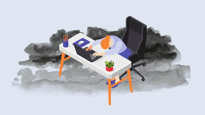 person slumped over desk