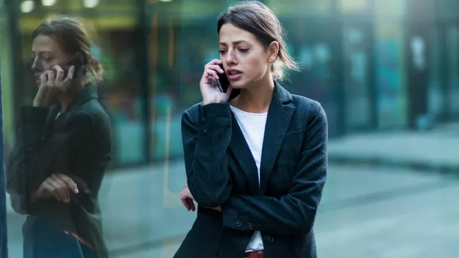 Frustrated woman on phone