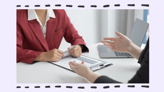 two women conversing in the office