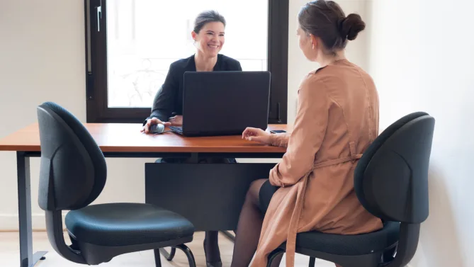 Two women talking. 