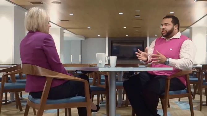 Employees of The Hartford talking at work