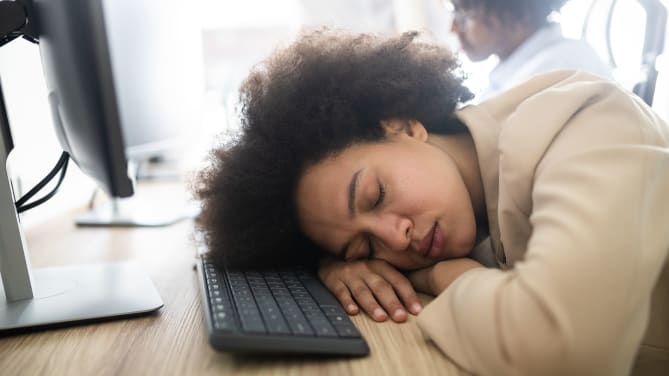 woman sleeping at work