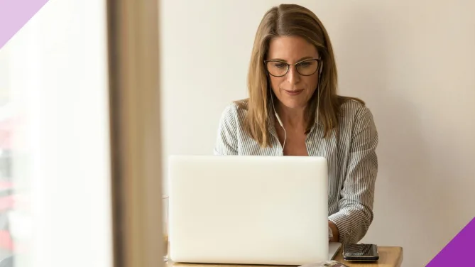 A self-employed professional working at a computer
