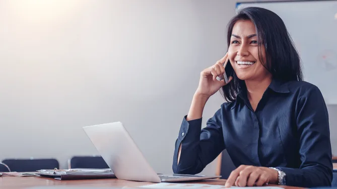 Woman smiling while talking on the phone
