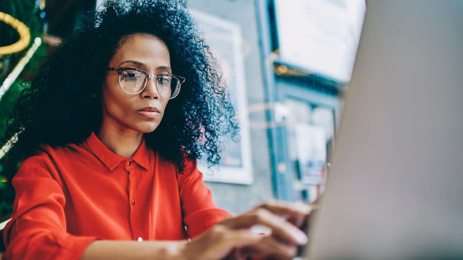 Woman typing on computer