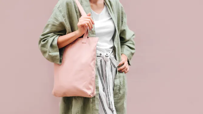 woman carrying tote bag to work