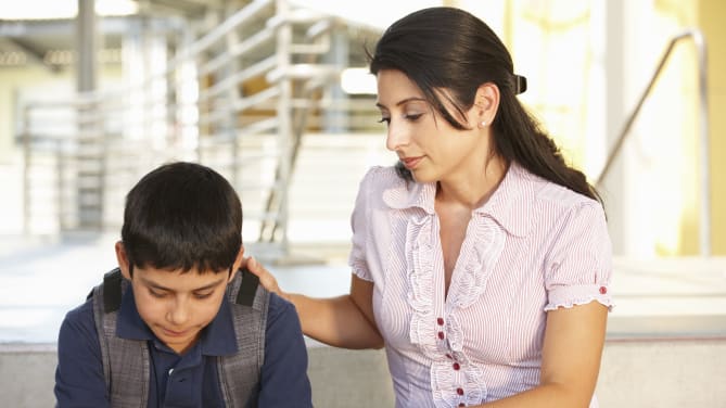 mother comforting son