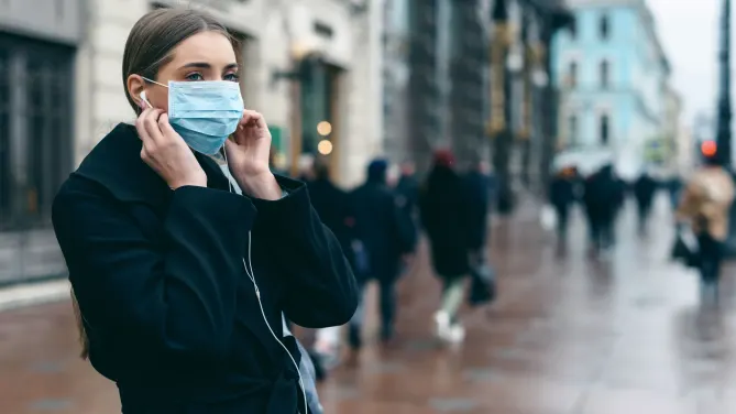 Woman with mask in street