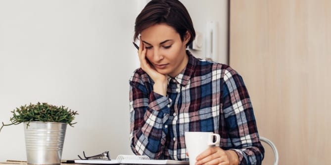 Sad woman at table