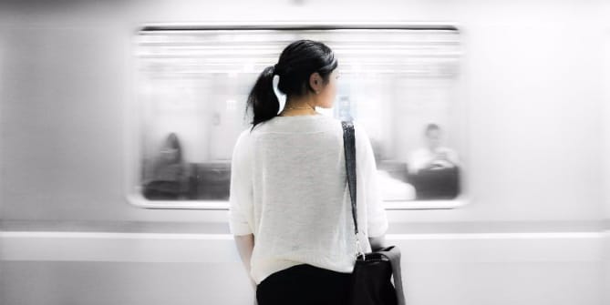 Woman waiting to get on train