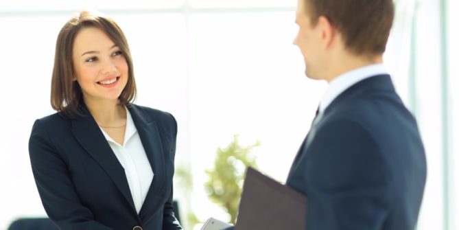 Businesswoman talking with man
