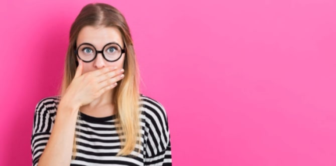 woman covering her mouth