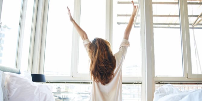 Woman getting out of bed