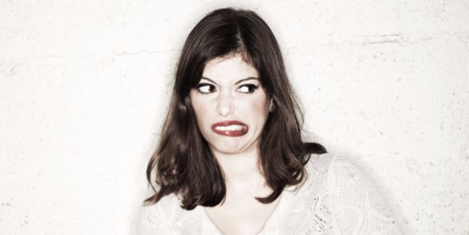 Woman grimacing
