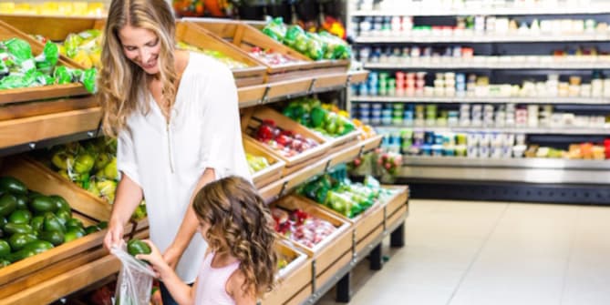 mother and daughter grocery shopping