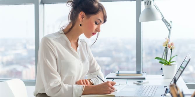 woman focusing on her computer