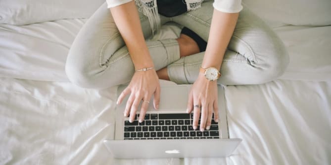 woman typing on computer