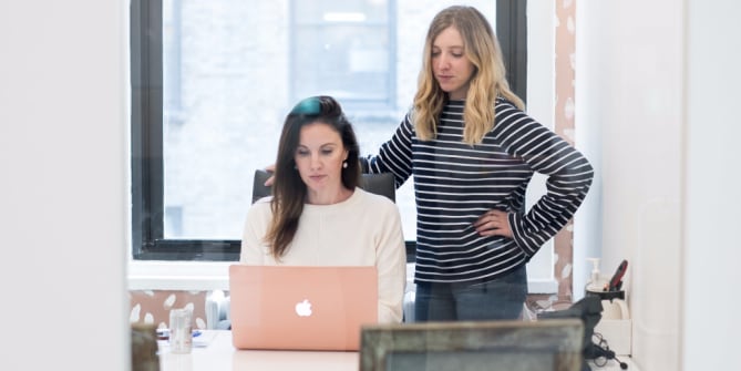 women working on taxes