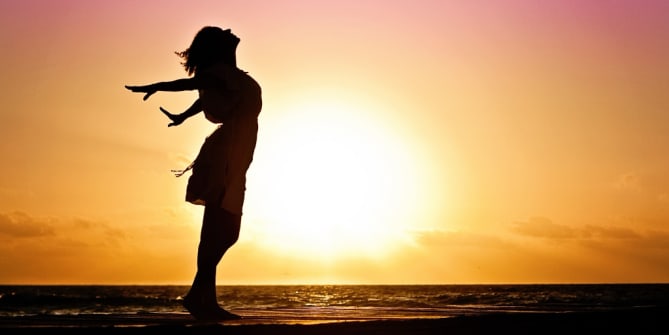 woman on the beach at sunset