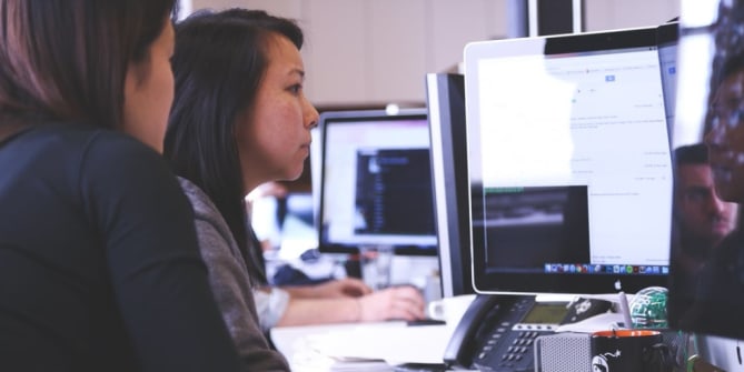 two women on a computer
