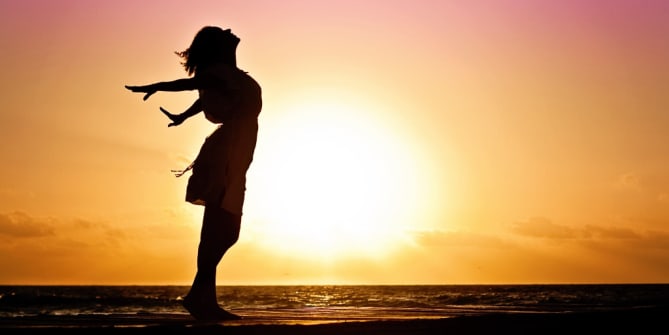 woman's silhouette by sunrise