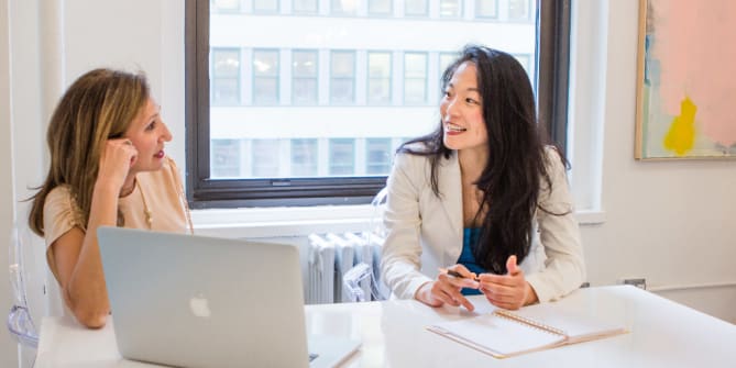 Female Coworkers Collaborating