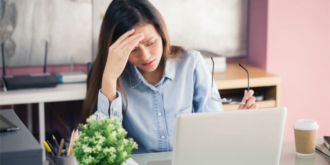 Woman with allergies at work