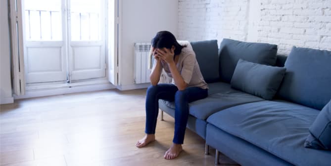 woman sitting on couch