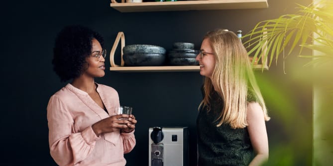 colleagues chatting by the coffee machine