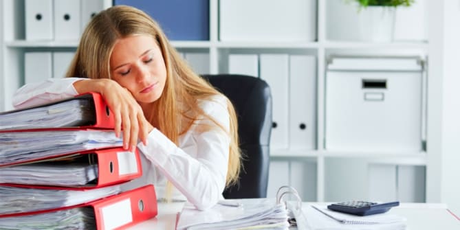 Woman asleep at work