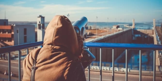 Woman looking through telescope
