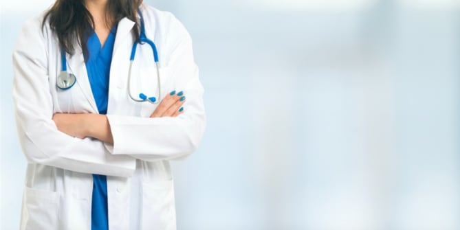 Woman doctor with arms crossed