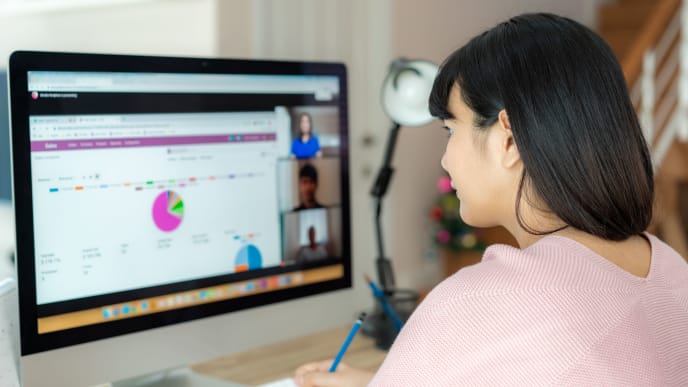 woman talking to her colleagues about plan in video conference