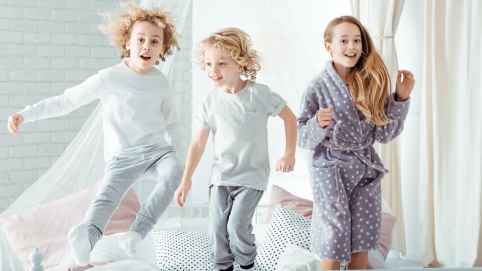 Kids jumping on the bed