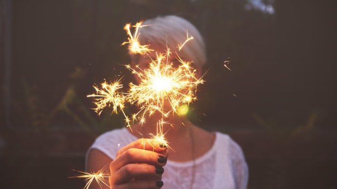 woman holding sparklers