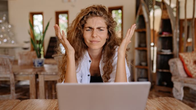 woman stressed in front of laptop