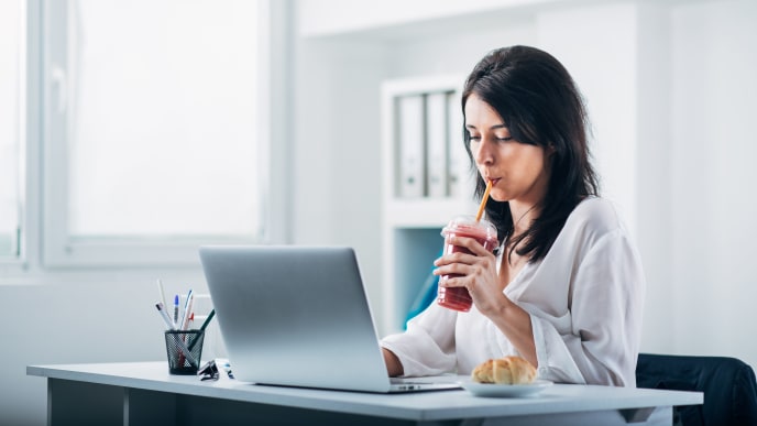 Woman eating at office