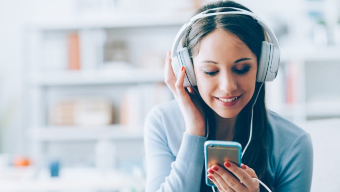 woman listening to headphones