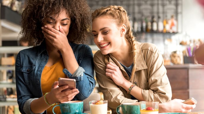 Women laughing at coffee