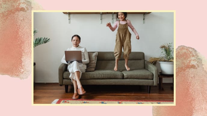 woman working from home with child jumping on couch