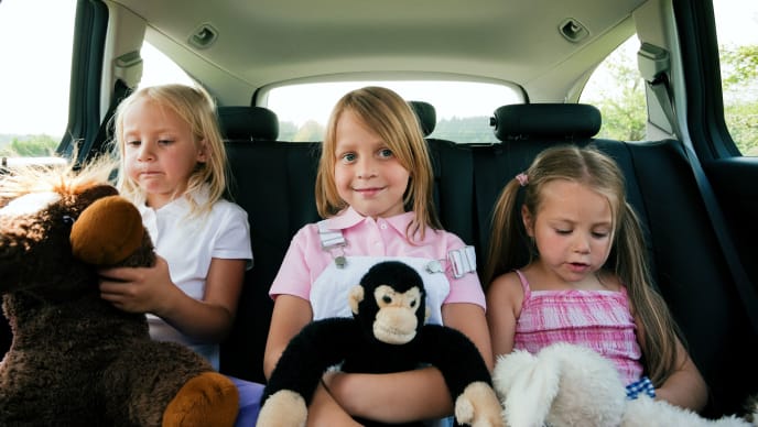 Three siblings in a car