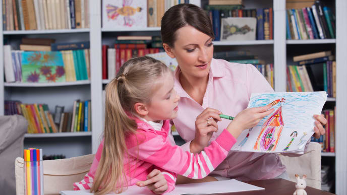 child psychologist working with young girl
