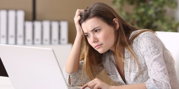 Stressed woman at a computer