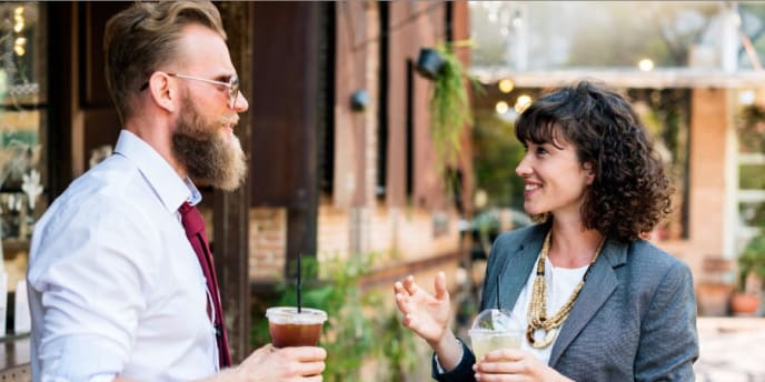 Woman and man talking over coffee
