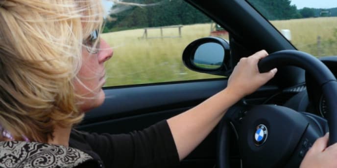 woman at steering wheel